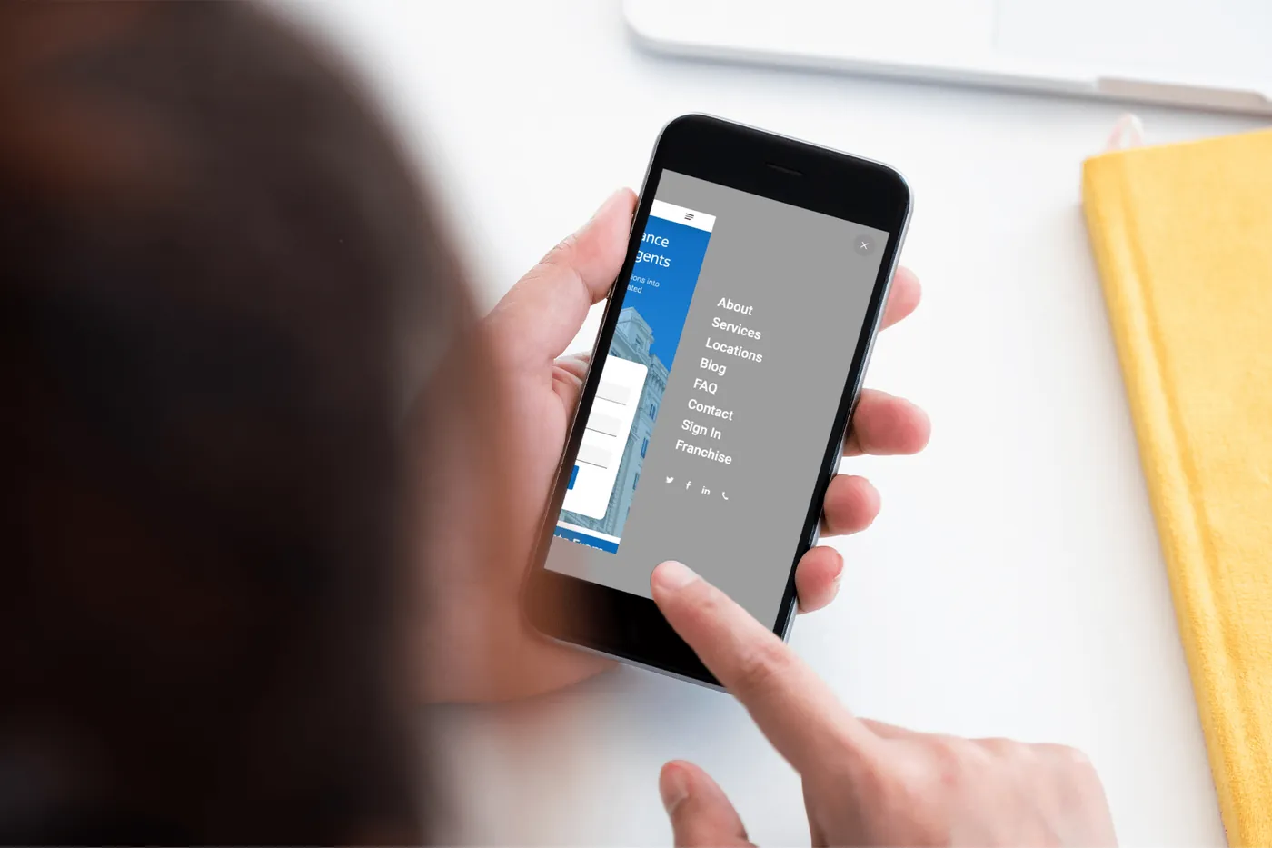Commission Express mobile navigation menu open on a phone, listing About, Services, Locations, Blog, FAQ, Contact, Sign In, and Franchise
